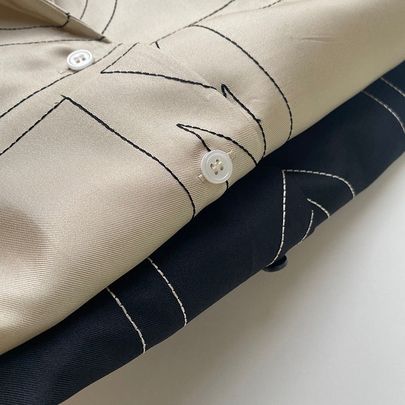 TOTEME Silk Twill Monogram Blouse – Embroidered Ivory Detailing & Lapel Collar