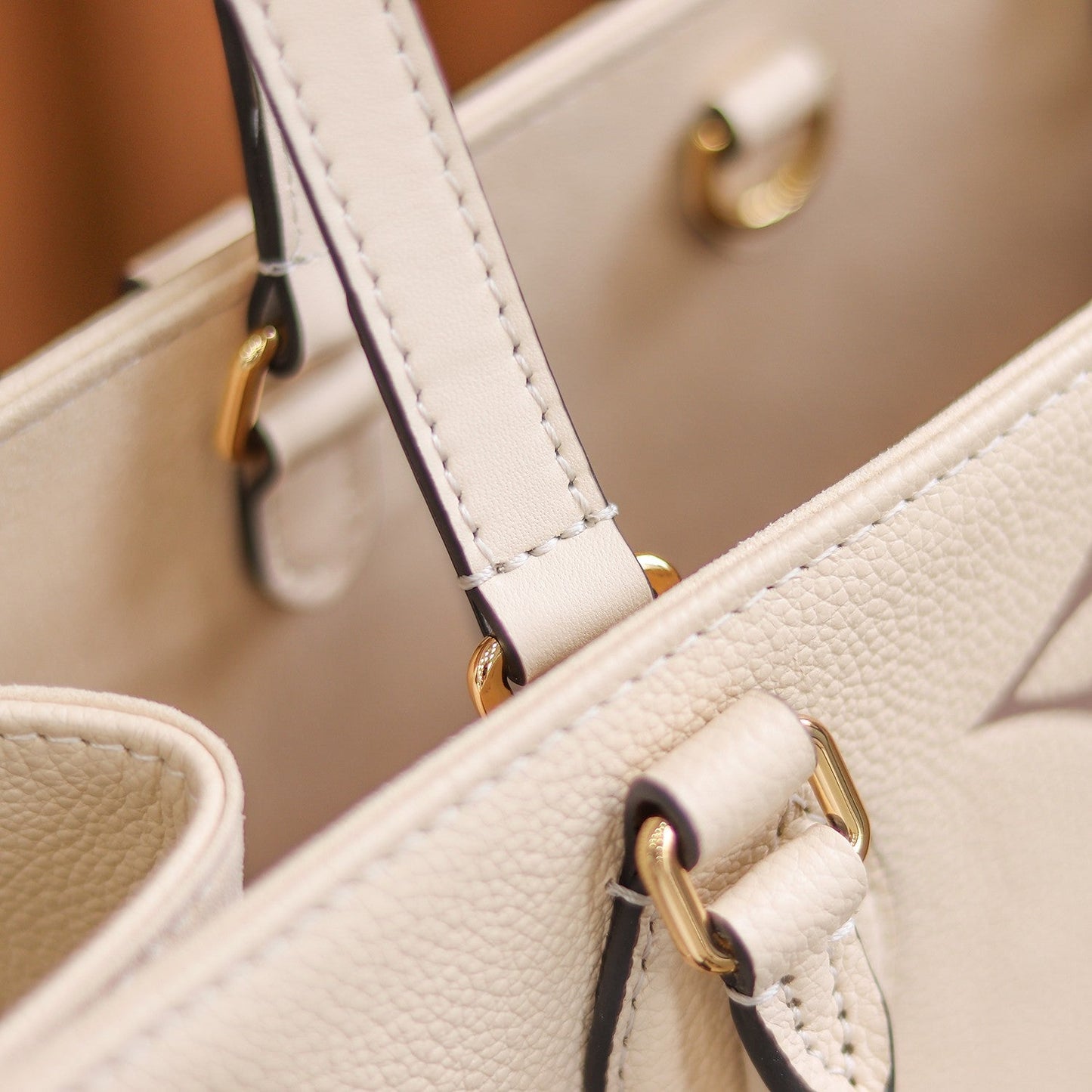 LV OnTheGo MM Creme/Rose Pink