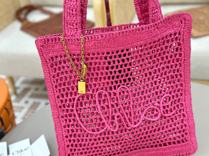 Banana Tote Bag In Raffia Fucshia